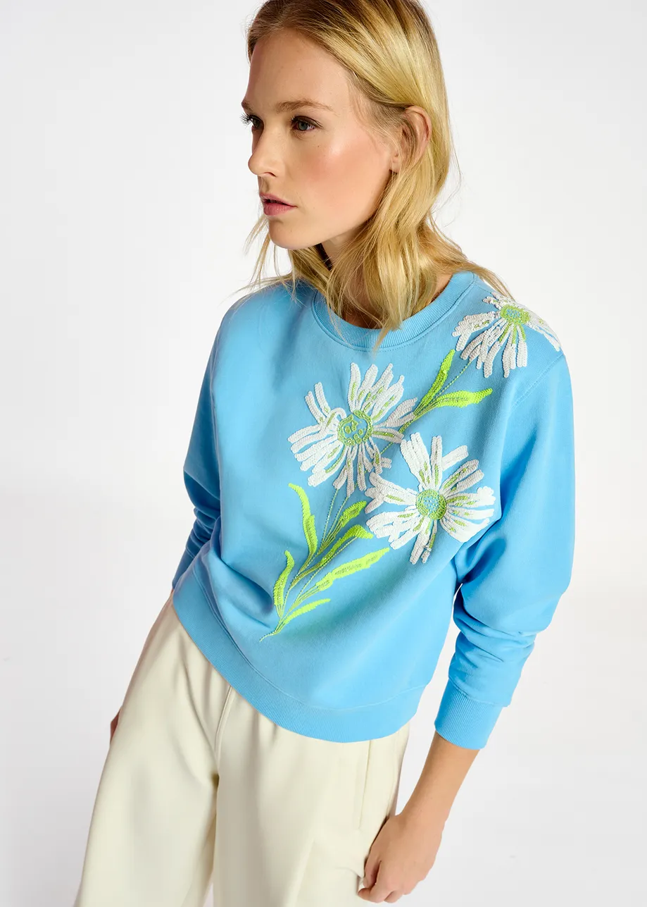 Blue sweatshirt with floral sequin embroideries