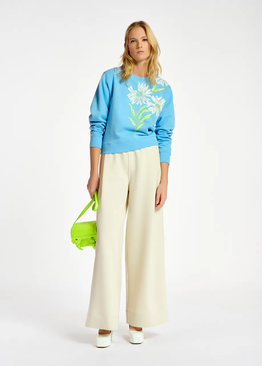 Blue sweatshirt with floral sequin embroideries