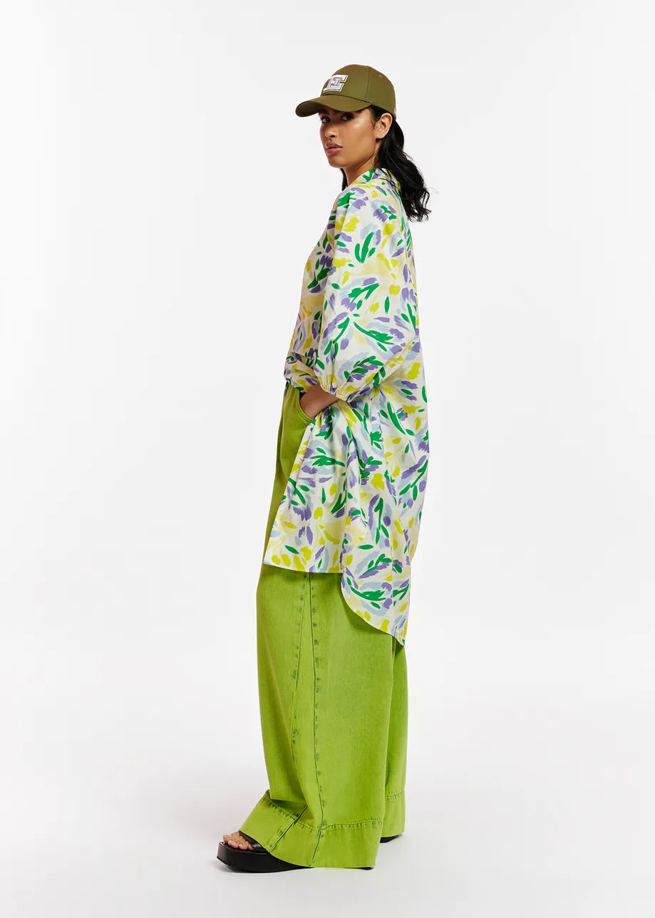 White, yellow and purple knee-length shirt dress with floral print