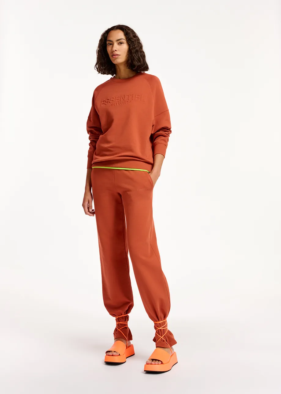 Donkeroranje joggingbroek van biokatoen-jersey