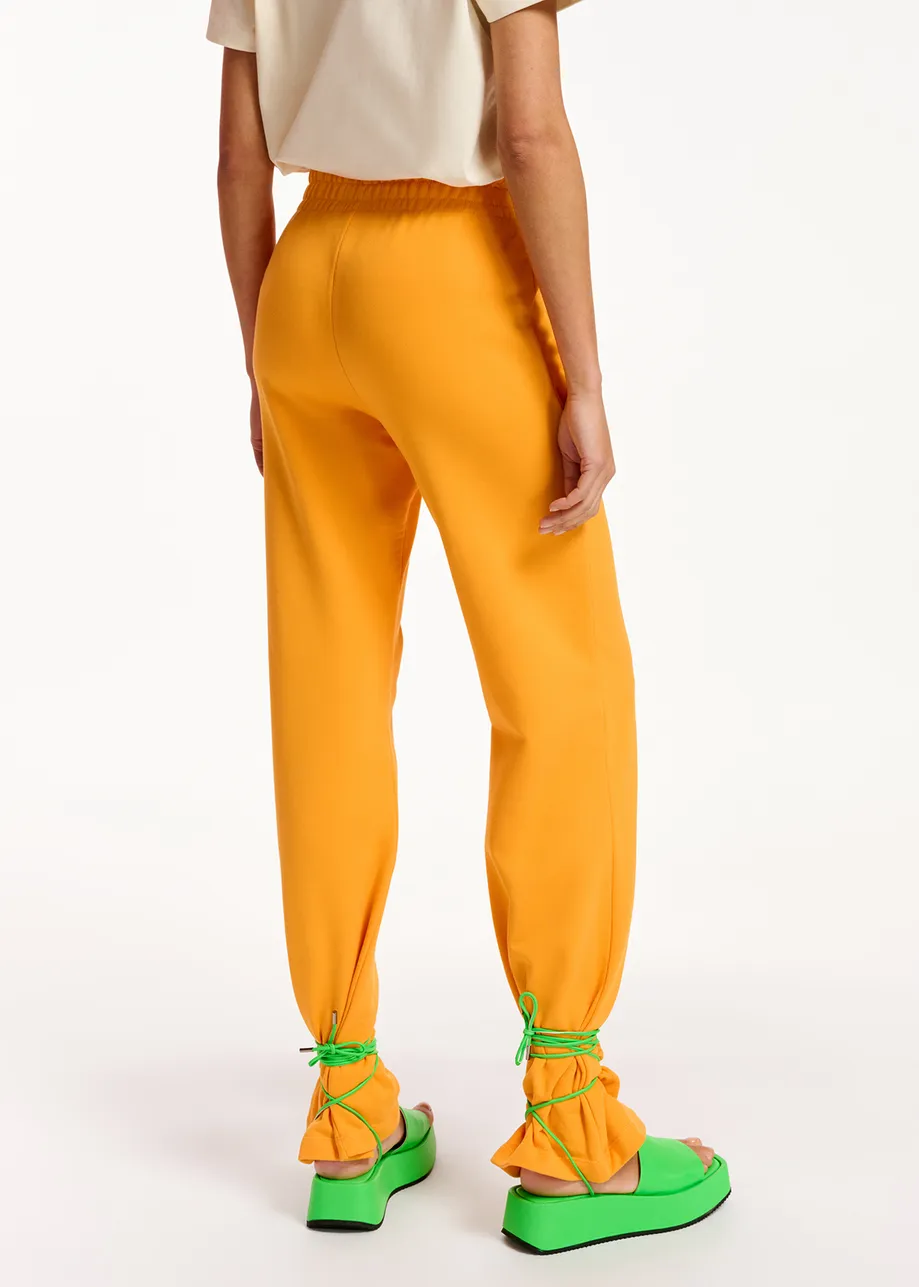 Oranje joggingbroek van biokatoen-jersey