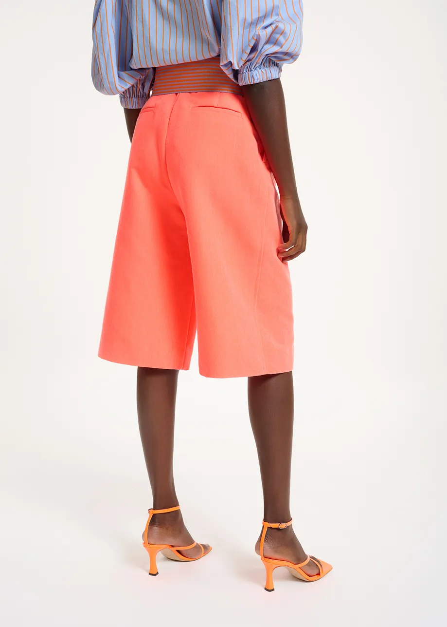 Coral red knee-length shorts