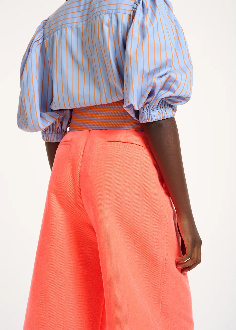 Coral red knee-length shorts