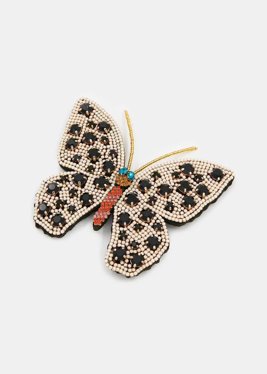 Off-white, black and orange rhinestone butterfly brooch