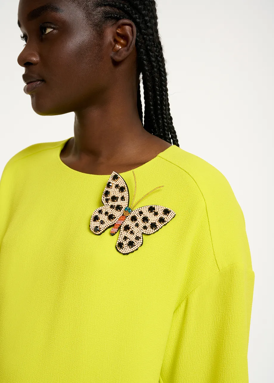 Off-white, black and orange rhinestone butterfly brooch
