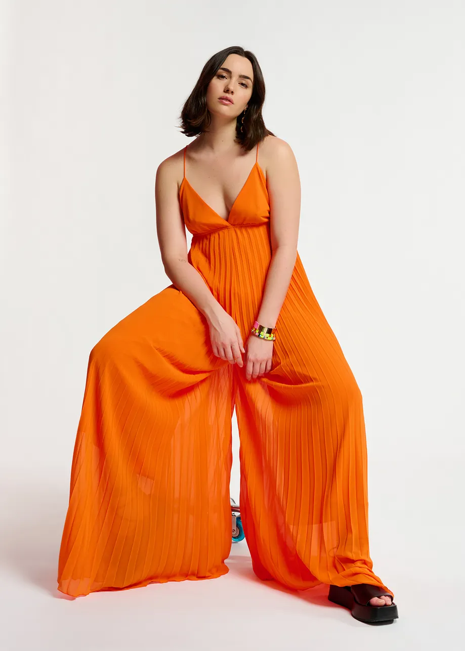Oranje geplisseerde jumpsuit met grafische print