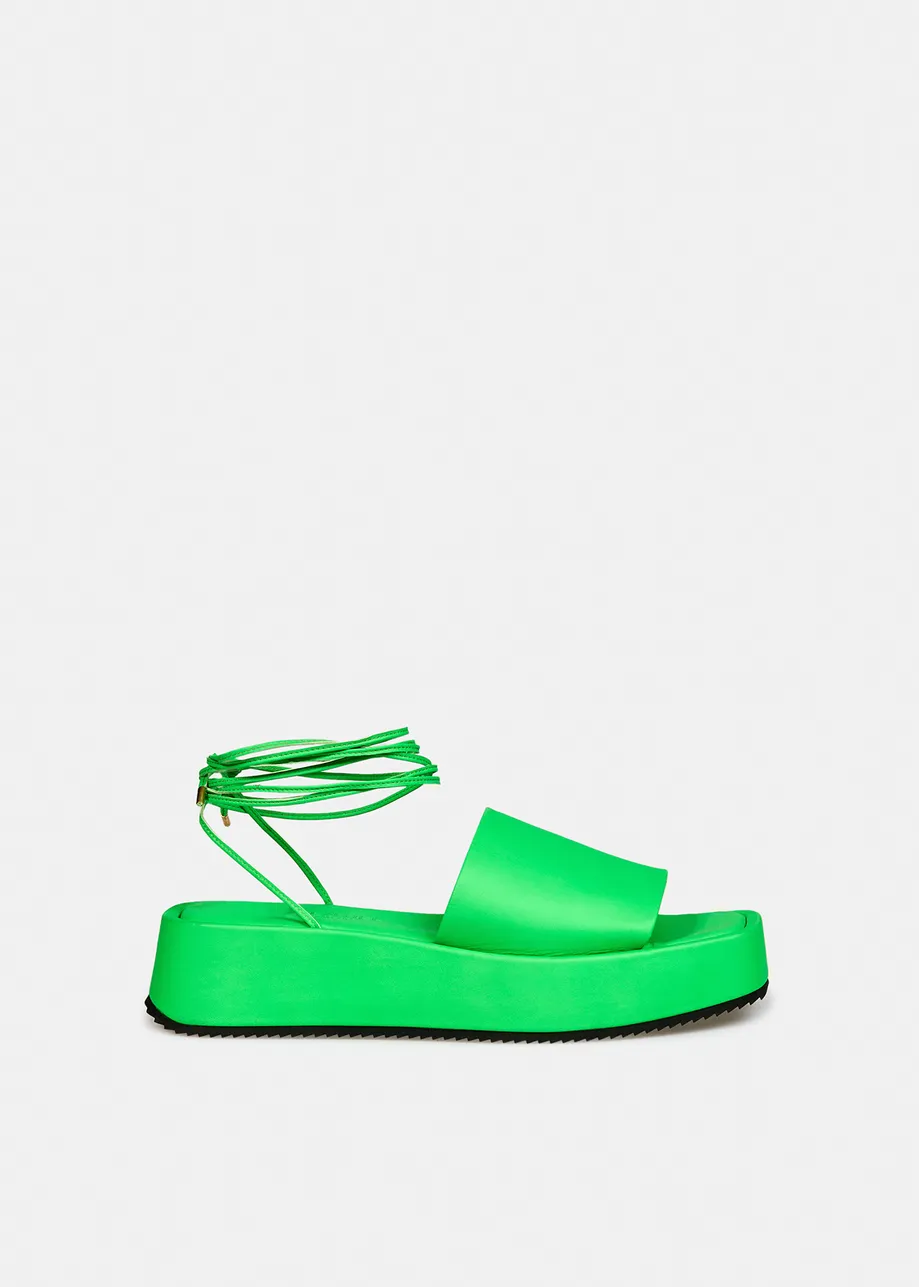 Neon green leather platform sandals with ankle ties