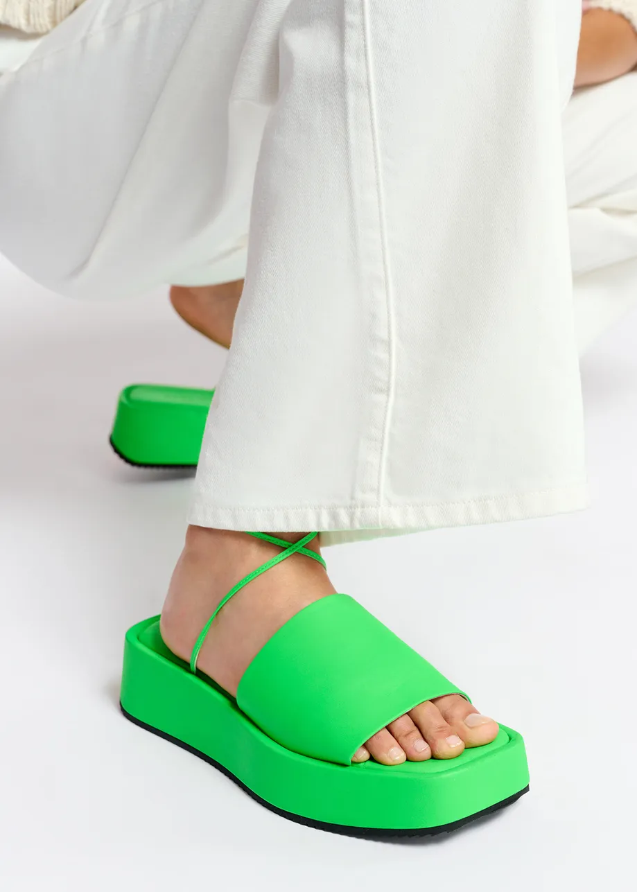 Neon green leather platform sandals with ankle ties