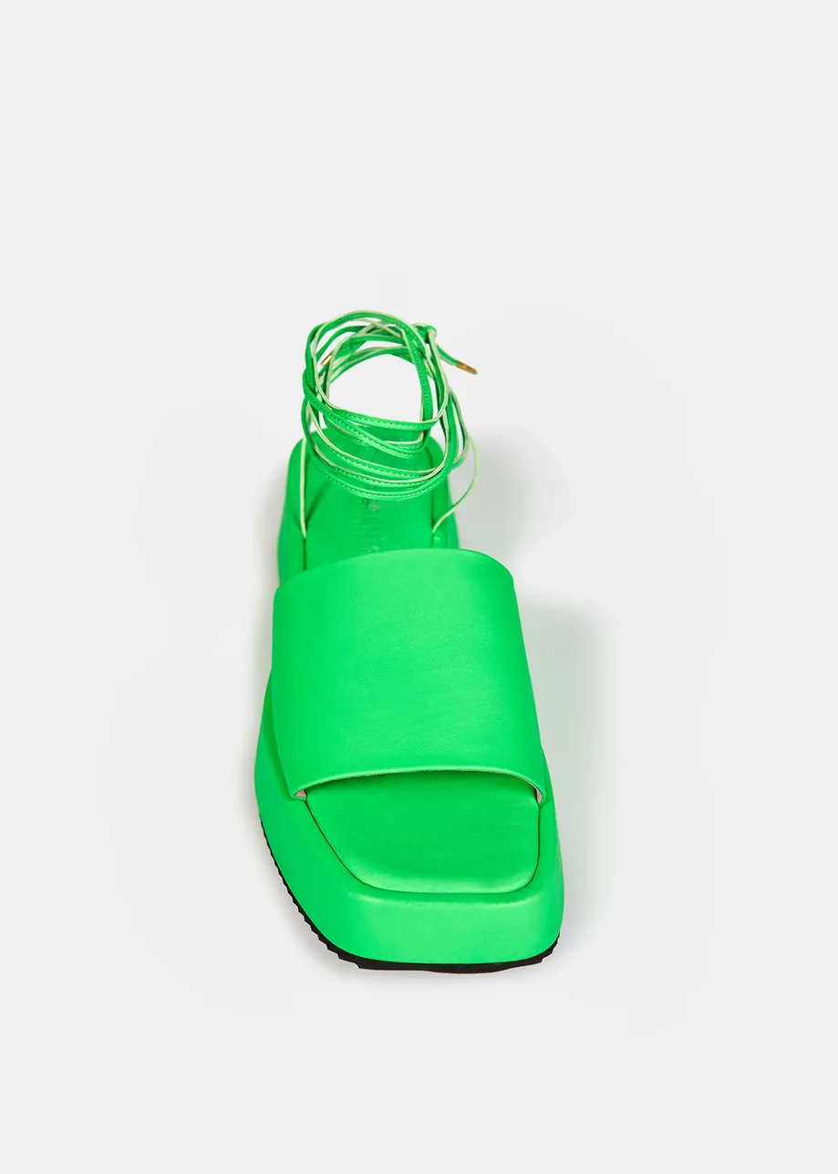 Neon green leather platform sandals with ankle ties