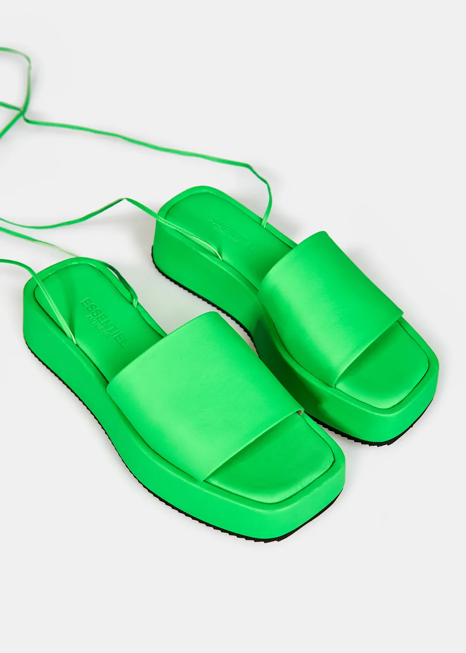 Neon green leather platform sandals with ankle ties
