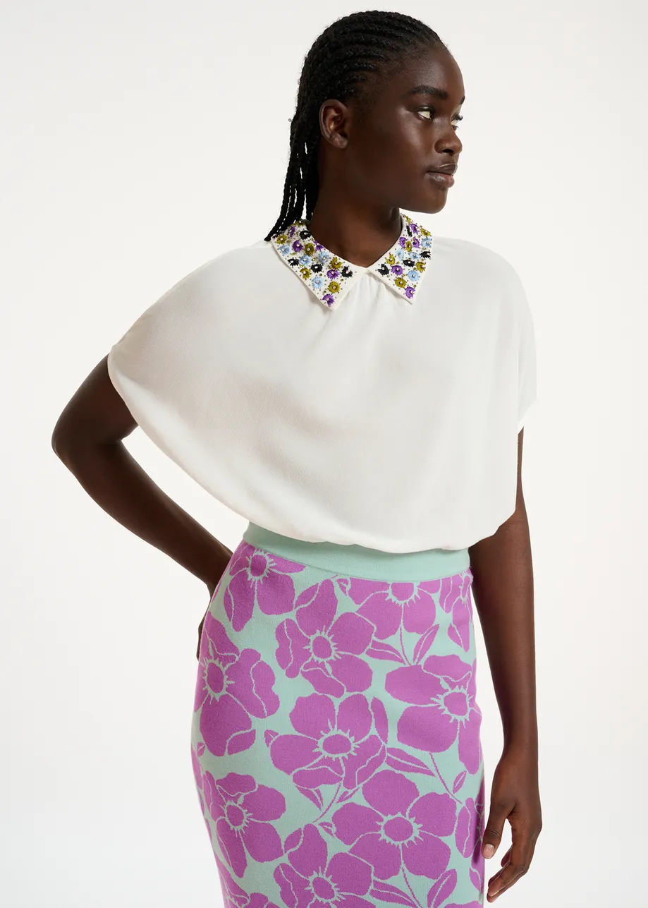 White short-sleeved top with rhinestone-embellished collar