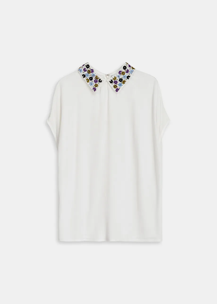 White short-sleeved top with rhinestone-embellished collar