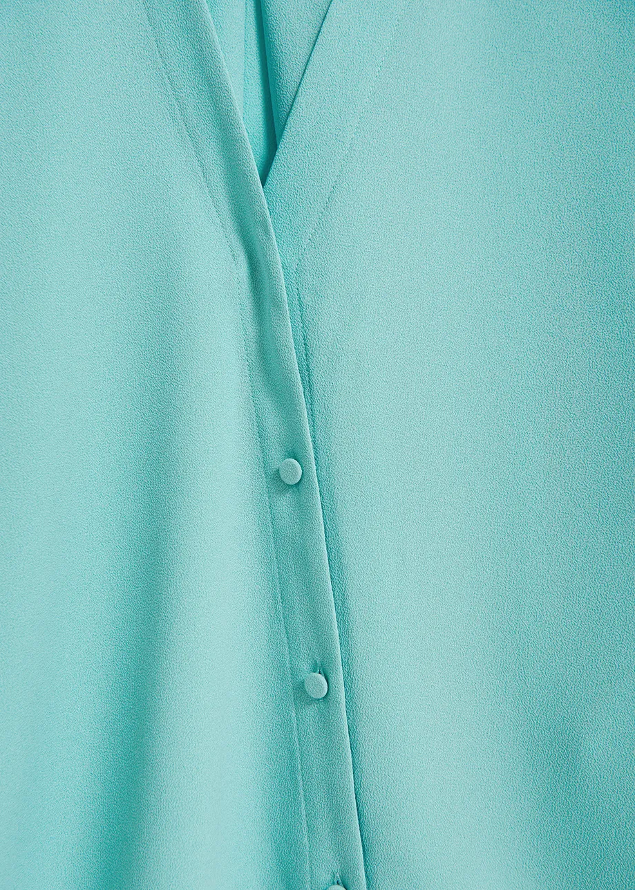 Turquoise V-neck shirt
