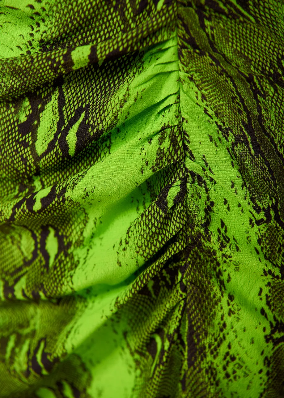 Lime green midi-length slip dress with snake print
