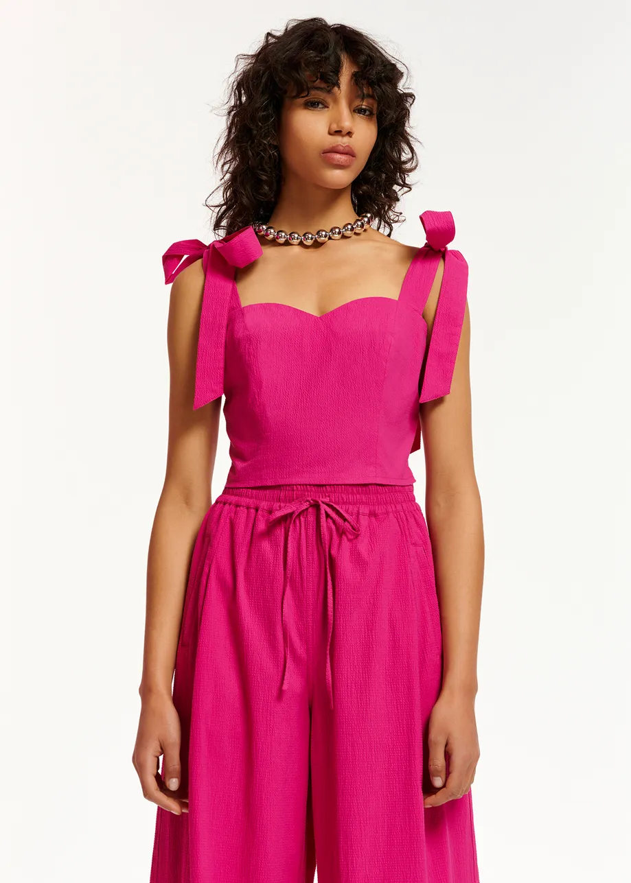 Purple bustier top with bows