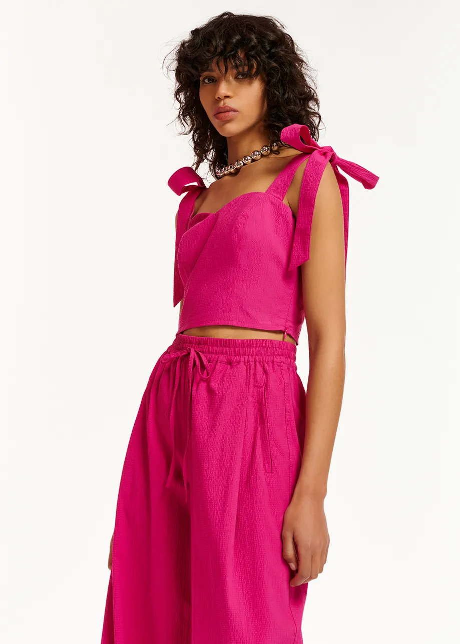Purple bustier top with bows