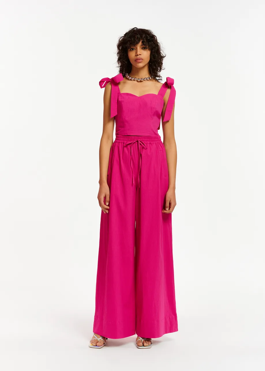 Purple bustier top with bows