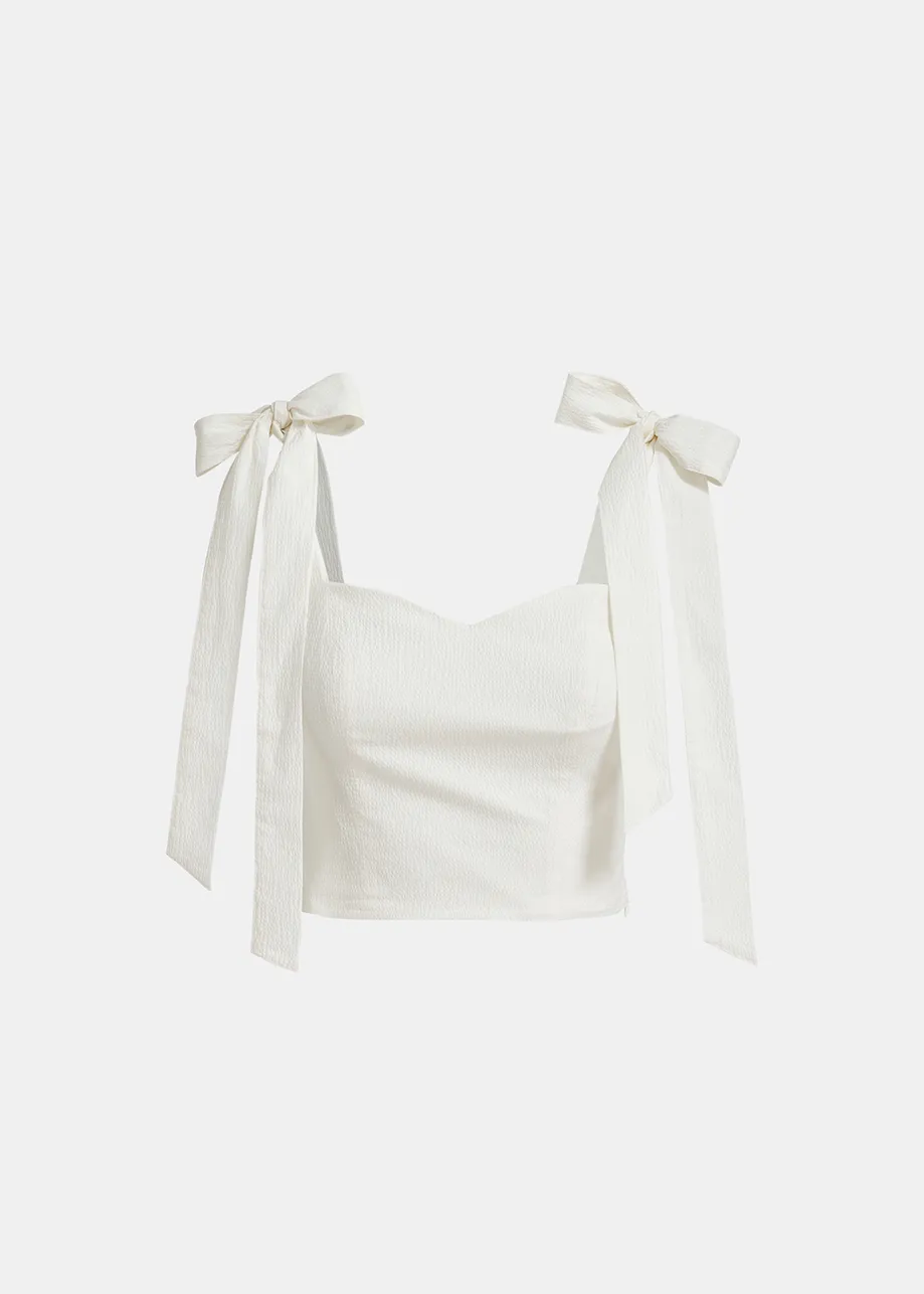 White bustier top with bows
