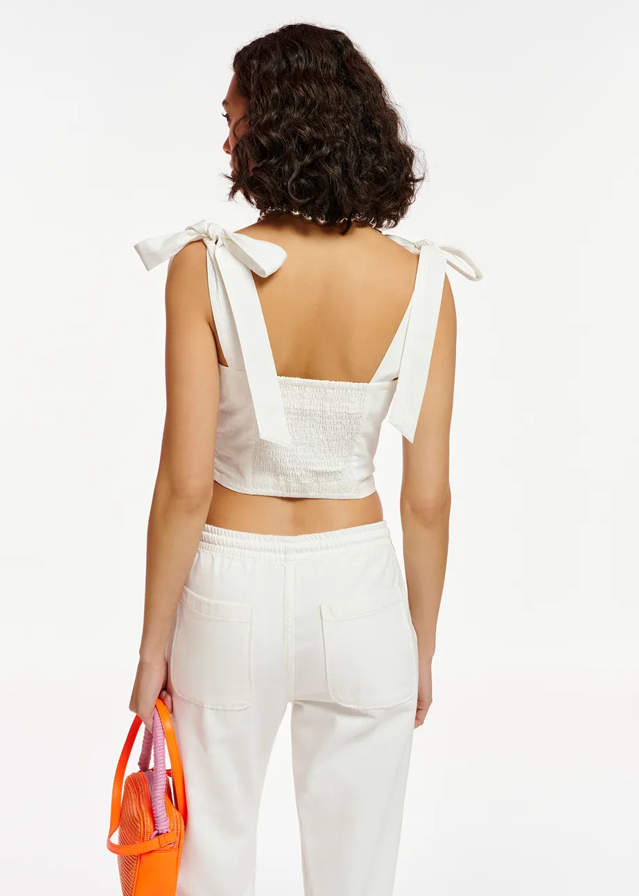 White bustier top with bows