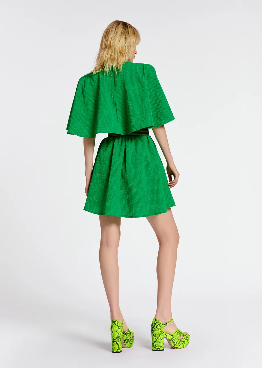 Groene mini-jurk met cape-mouwen