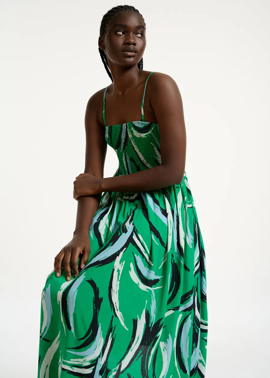 Green sleeveless midi-length dress with abstract print