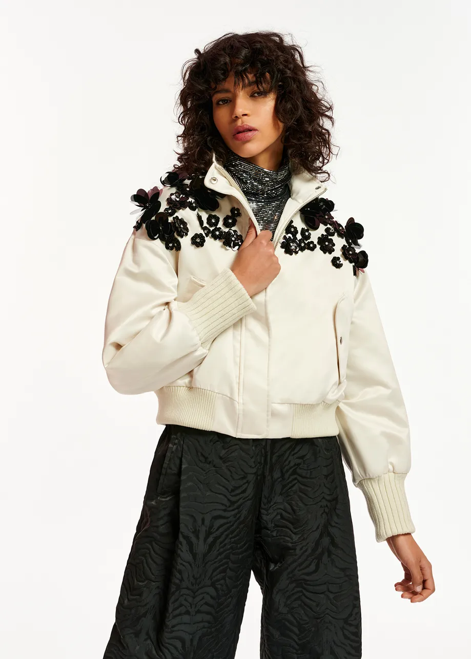 Off-white satin bomber jacket with sequin embellishments