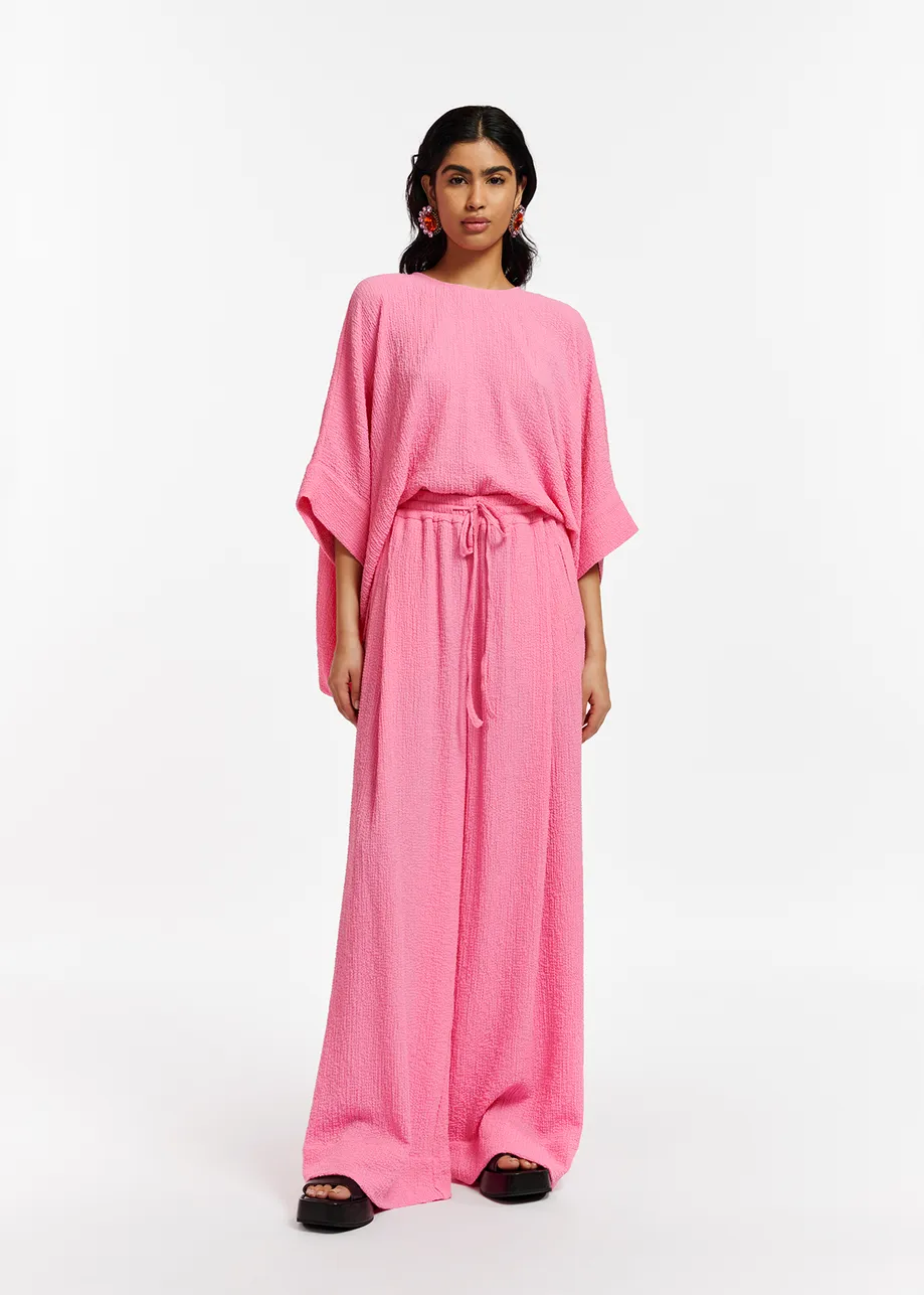 Pink wide-leg seersucker pants
