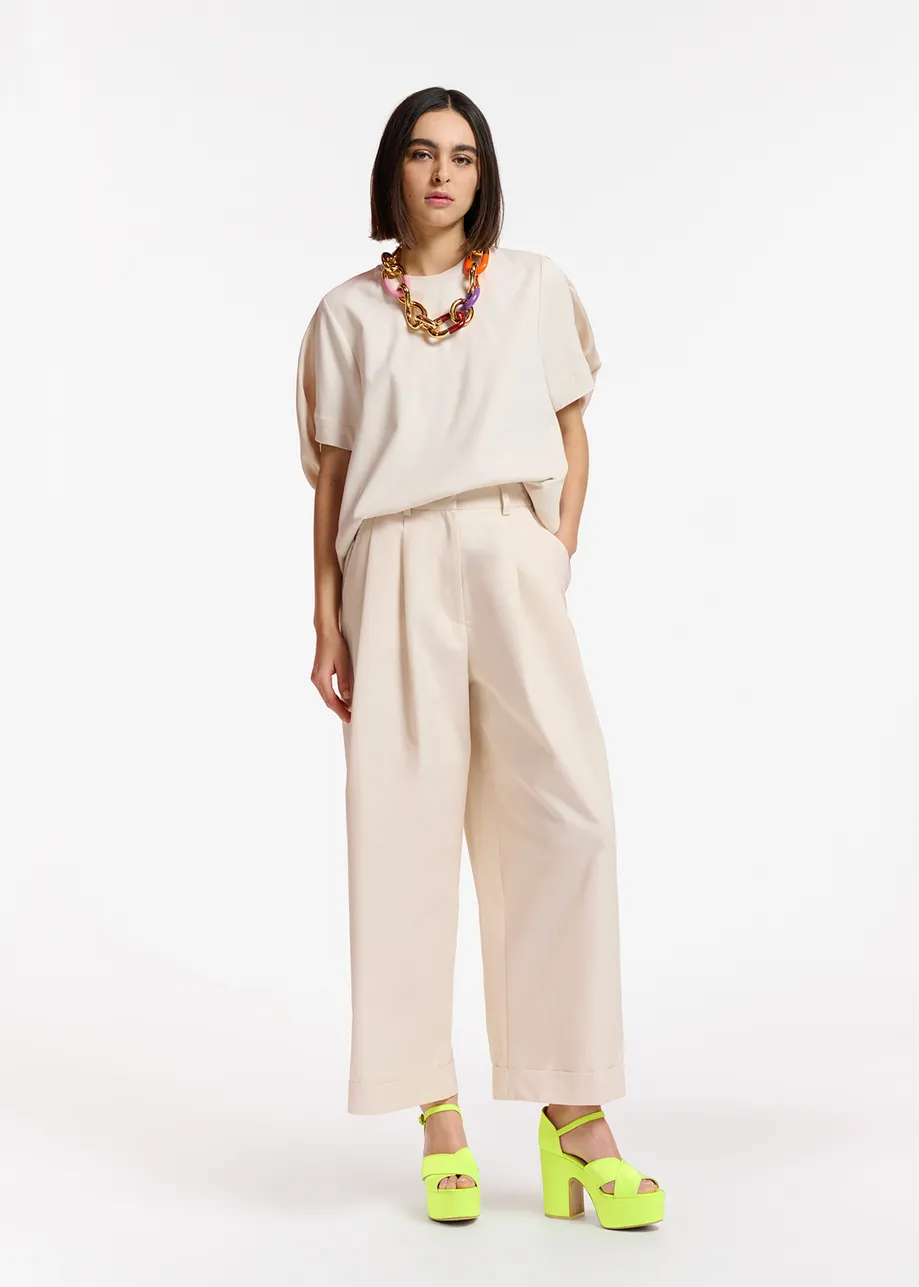 Gebroken witte broek met brede pijpen