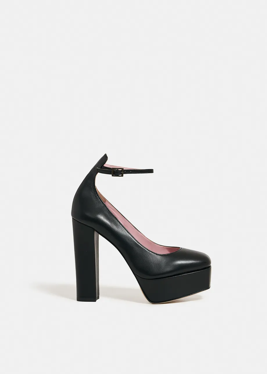 Black faux leather platform pumps