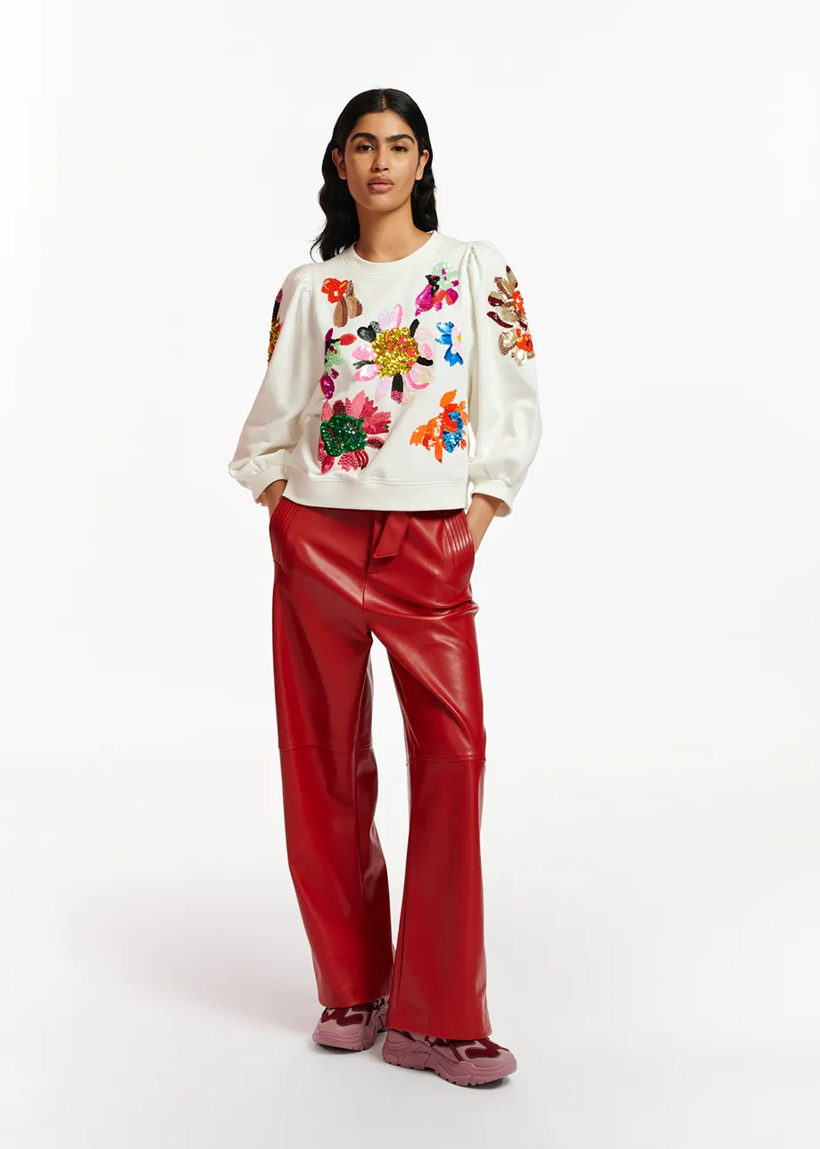 Red faux leather belted pants