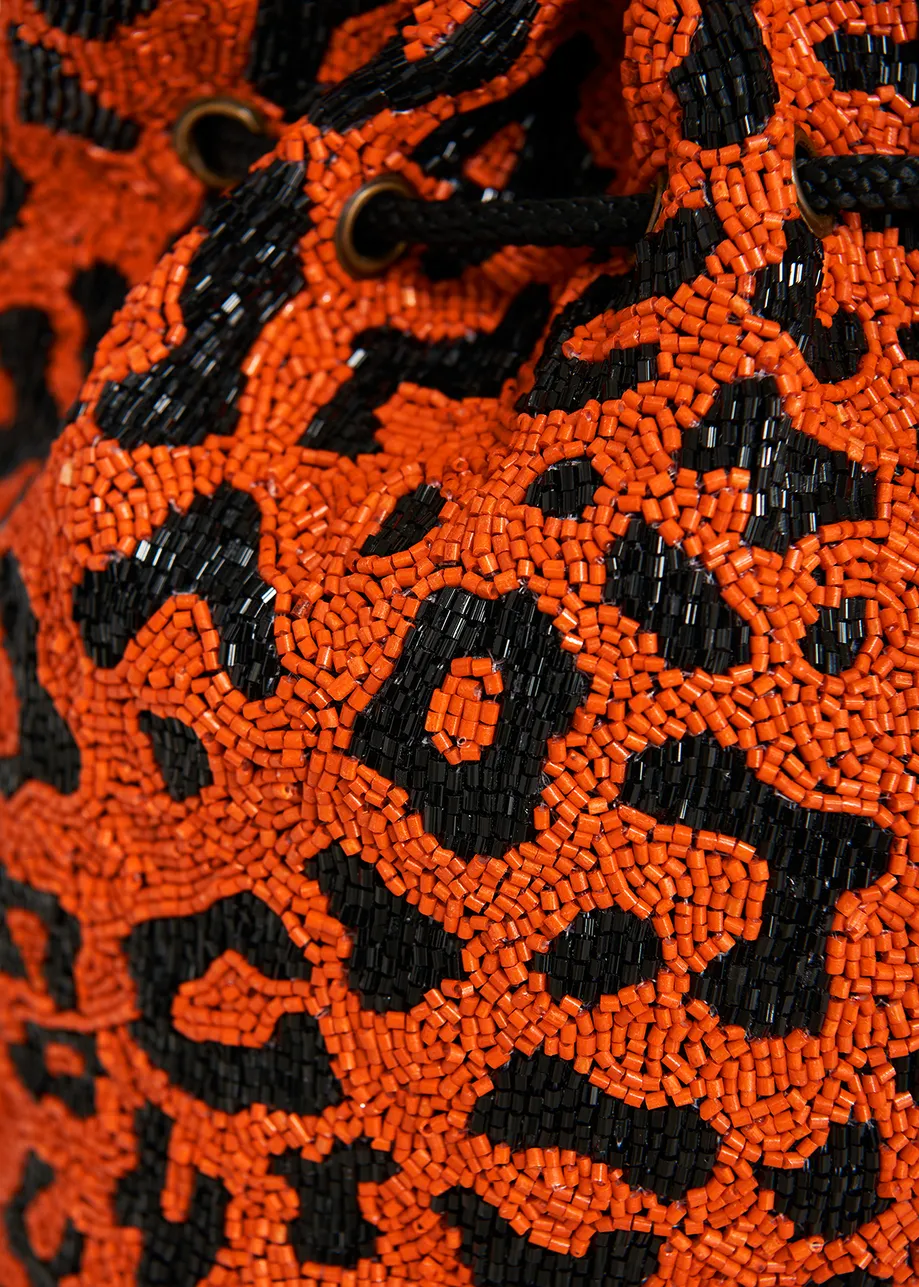 Orange bead-embellished mini bag with leopard motif