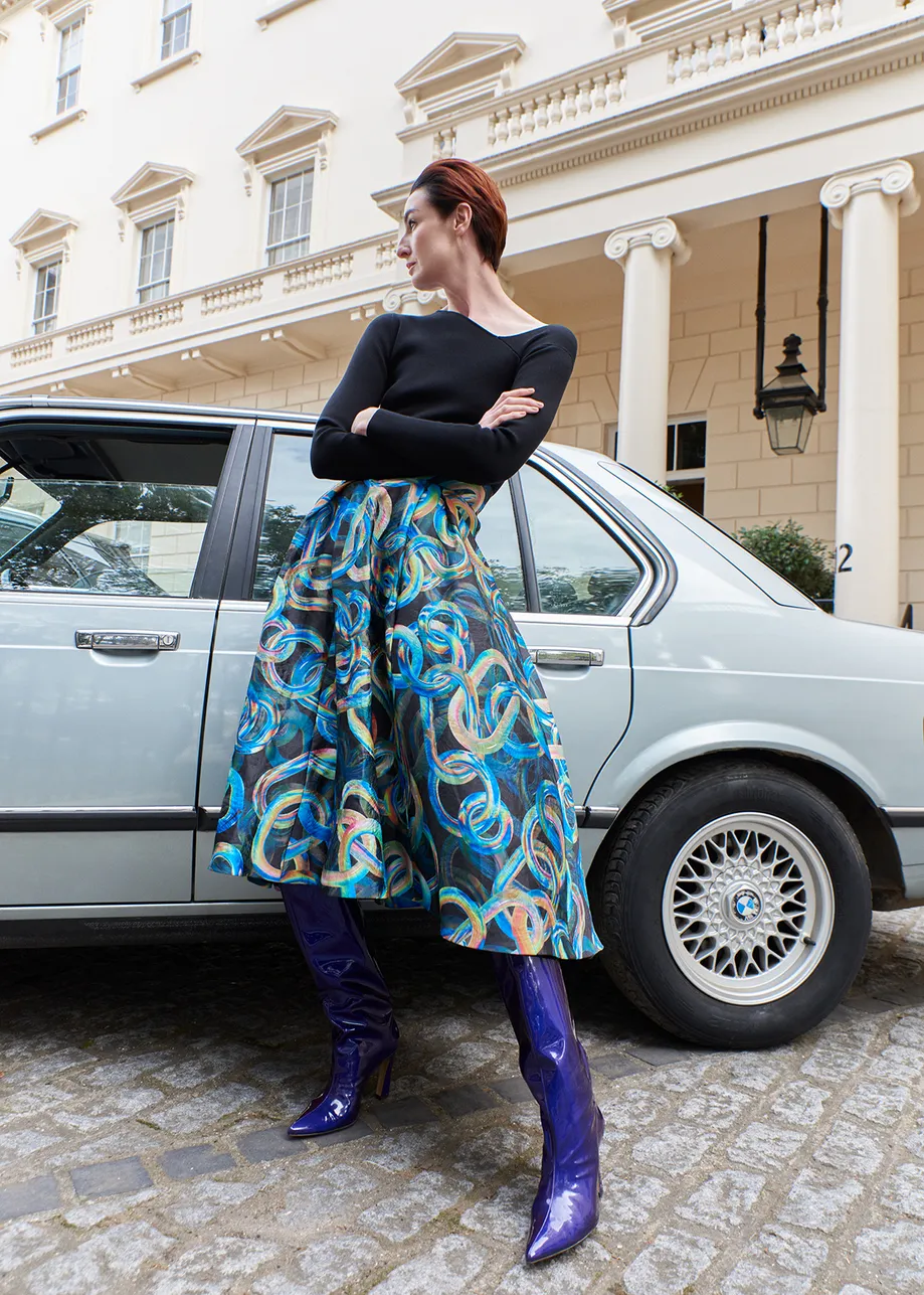 Black jacquard pleated midi skirt with abstract print