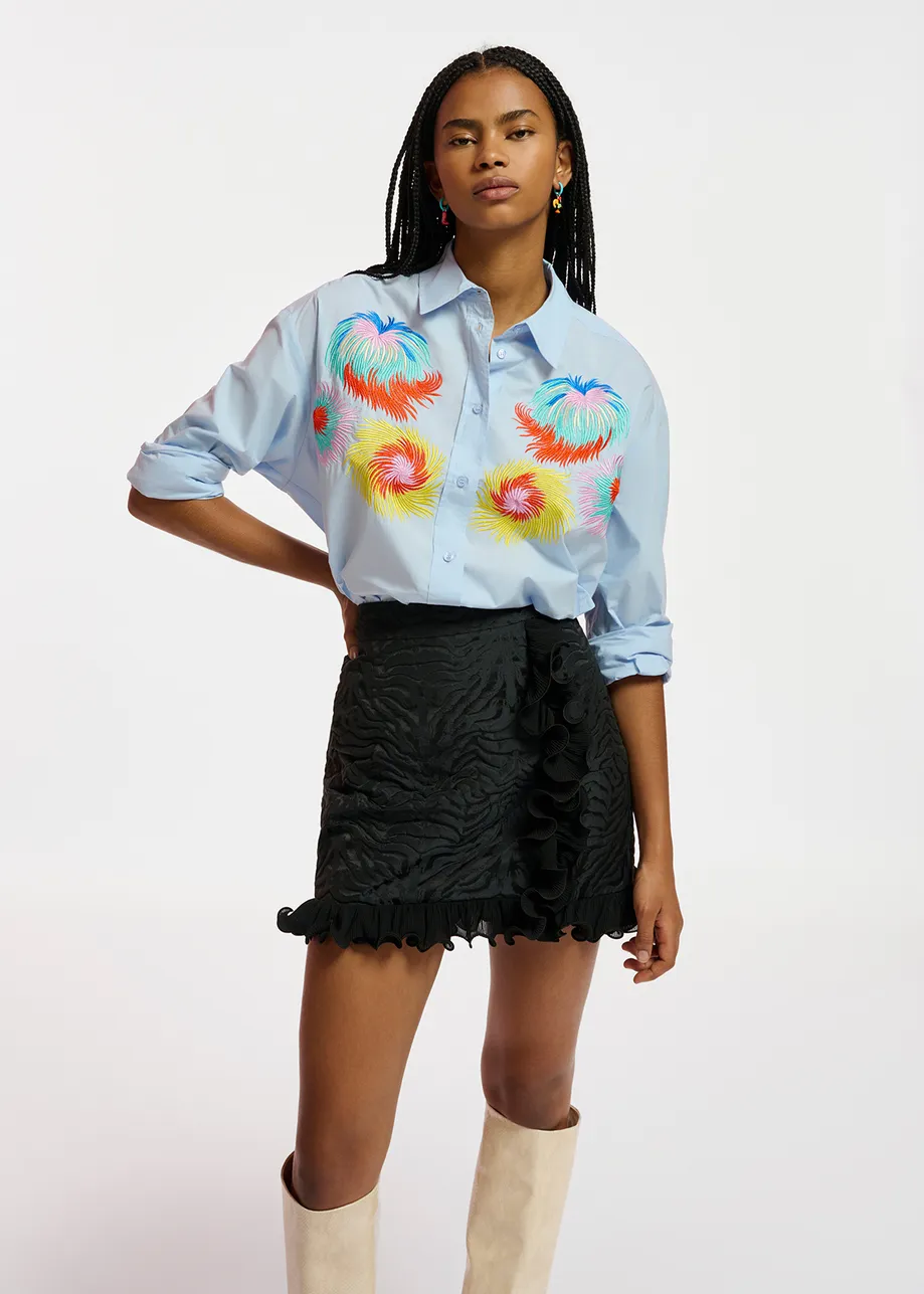 Light blue cotton shirt with multicolored embroideries