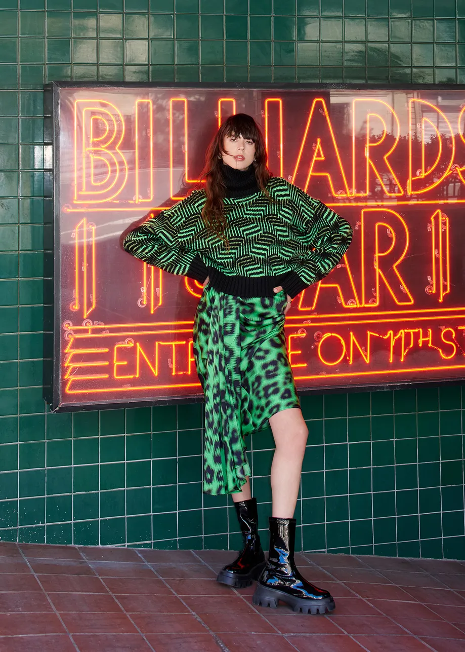 Green draped midi-length skirt with leopard print