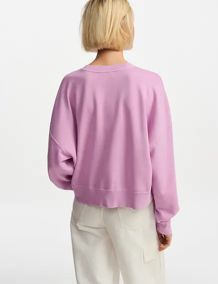 Sweatshirt en coton bio lilas avec texte