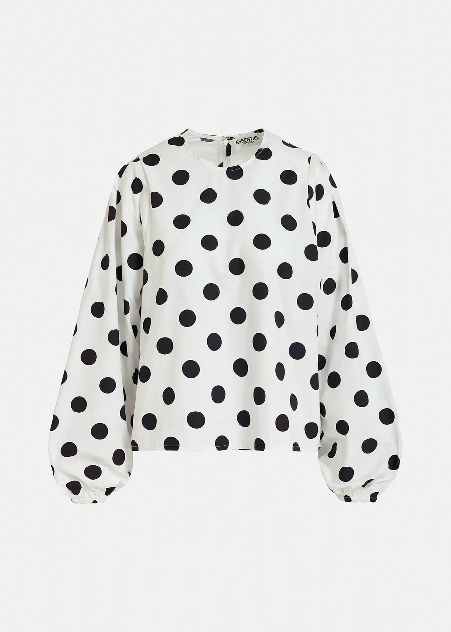 White and black polka-dot top with puffed sleeves