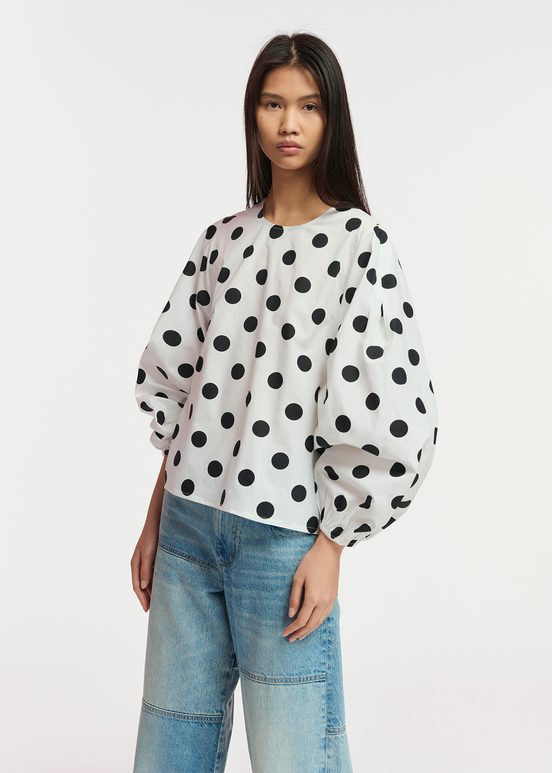 White and black polka-dot top with puffed sleeves