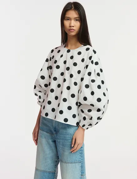 White and black polka-dot top with puffed sleeves