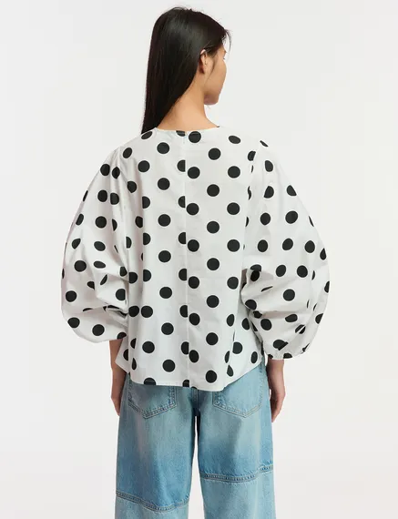 White and black polka-dot top with puffed sleeves