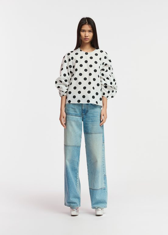 White and black polka-dot top with puffed sleeves