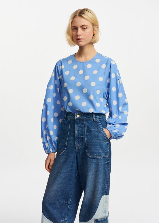 Blue and white polka-dot top with puffed sleeves