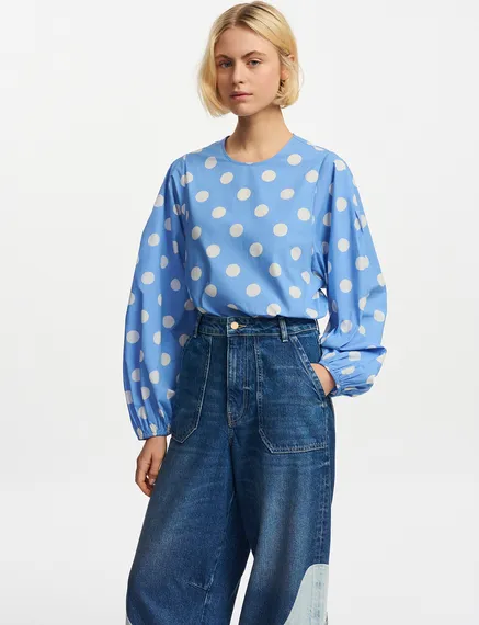 Blue and white polka-dot top with puffed sleeves