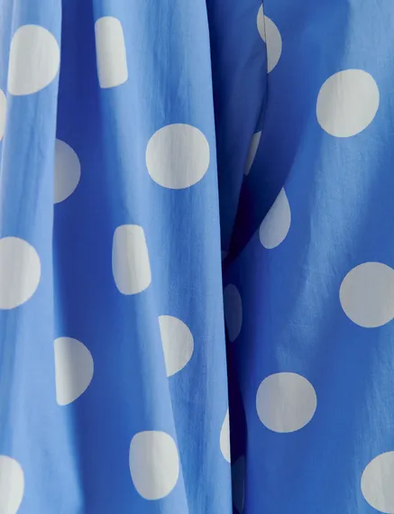 Blue and white polka-dot top with puffed sleeves