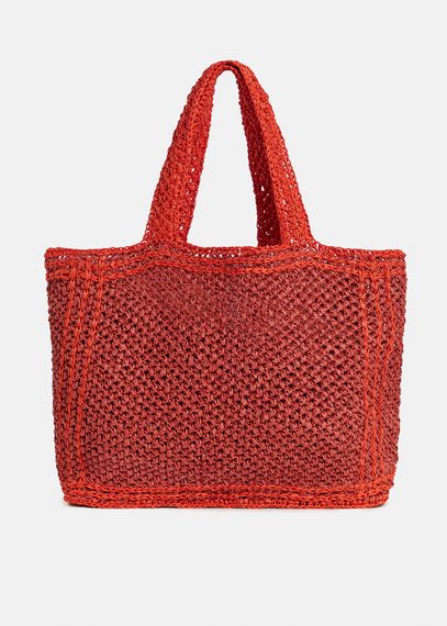 Baksteenrode en oranje shopper in papieren raffia