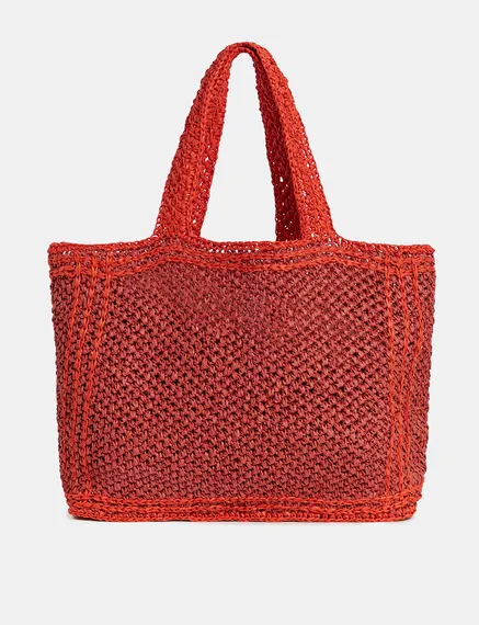 Baksteenrode en oranje shopper in papieren raffia