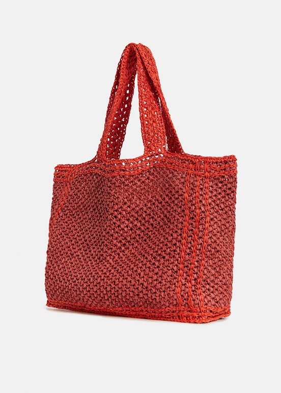 Baksteenrode en oranje shopper in papieren raffia