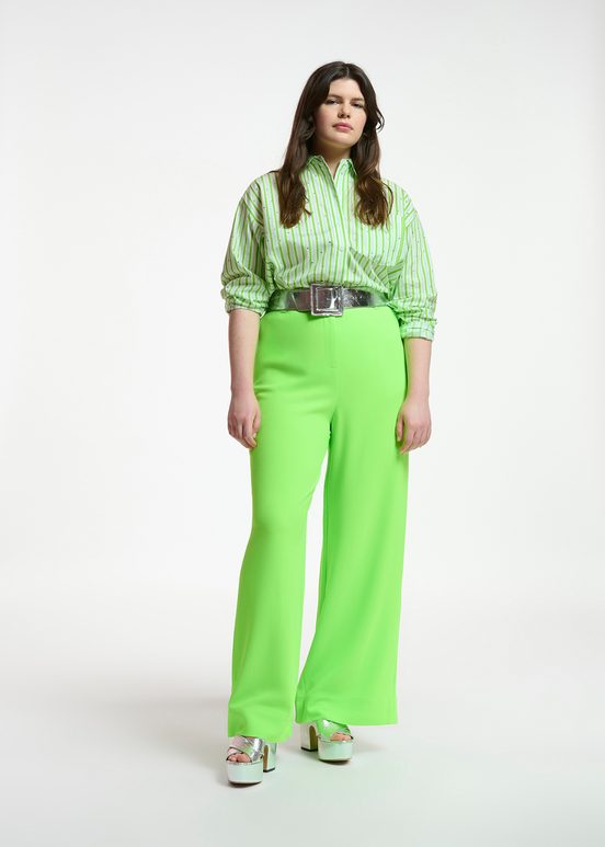 Fluogroene broek met brede pijpen