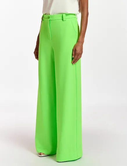 Fluogroene broek met brede pijpen