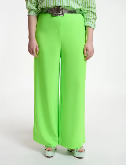 Fluogroene broek met brede pijpen