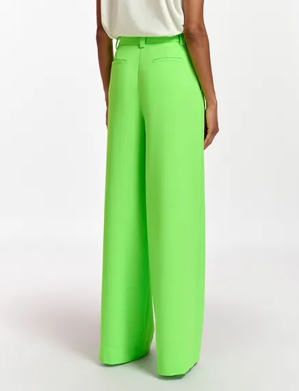 Fluogroene broek met brede pijpen